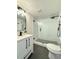 Modern bathroom features a glass shower enclosure, white vanity, and black fixtures at 321 42Nd S Ave, St Petersburg, FL 33705