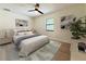 Bright bedroom boasts a ceiling fan and a large window for natural light at 321 42Nd S Ave, St Petersburg, FL 33705