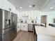 Modern kitchen with stainless steel appliances, white cabinetry, and stylish countertops at 321 42Nd S Ave, St Petersburg, FL 33705