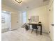 Well-lit office space features a desk, chair, and tiled floors at 321 42Nd S Ave, St Petersburg, FL 33705
