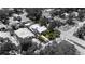 Property overview showing its location, fenced yard, lush landscaping, and surrounding neighborhood at 3220 W San Pedro St, Tampa, FL 33629