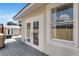 Back of house showcasing a gray deck with white doors and windows at 3220 W San Pedro St, Tampa, FL 33629
