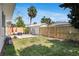 Backyard showing grass and privacy fence with a detached bedroom or office at 3220 W San Pedro St, Tampa, FL 33629