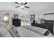 Bedroom boasts white walls, a ceiling fan, and a view to the private, fenced backyard at 3220 W San Pedro St, Tampa, FL 33629
