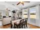 Cozy dining area featuring a wooden table set adjacent to a living room with hardwood floors at 3220 W San Pedro St, Tampa, FL 33629