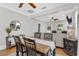 Bright dining area with wood table, chairs, decorative rug, and view into living space at 3220 W San Pedro St, Tampa, FL 33629