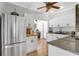Modern kitchen featuring white cabinetry, stainless steel appliances, and hardwood flooring at 3220 W San Pedro St, Tampa, FL 33629