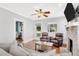Bright and airy living room with hardwood floors, neutral decor, comfortable seating, and an open doorway at 3220 W San Pedro St, Tampa, FL 33629
