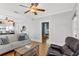 Bright and airy living room with hardwood floors, neutral decor, and an open layout at 3220 W San Pedro St, Tampa, FL 33629