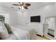 Spacious main bedroom with a dresser, television, and ensuite bathroom at 3220 W San Pedro St, Tampa, FL 33629