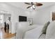 Bright main bedroom featuring a TV, dresser, and access to other rooms at 3220 W San Pedro St, Tampa, FL 33629