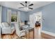 Inviting home office featuring hardwood floors, natural light, and comfortable seating at 3220 W San Pedro St, Tampa, FL 33629
