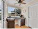 Bright office nook with custom wood desk, sliding doors, and natural light at 3220 W San Pedro St, Tampa, FL 33629