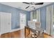 Bright office space featuring a desk, hardwood floors, and calming blue walls at 3220 W San Pedro St, Tampa, FL 33629