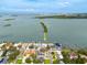 Beautiful waterfront property with a private dock, nestled among lush greenery, offering stunning views of the bay at 3290 Sunset N Dr, St Petersburg, FL 33710