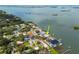 Waterfront home featuring a private dock, lush landscaping, and stunning views of the bay in a desirable neighborhood at 3290 Sunset N Dr, St Petersburg, FL 33710
