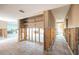 Hallway in need of restoration, revealing tile flooring and access to various spaces at 3290 Sunset N Dr, St Petersburg, FL 33710