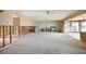 Open-concept living space awaiting renovation, showcasing ample room for customization with exposed framing and abundant natural light at 3290 Sunset N Dr, St Petersburg, FL 33710