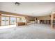 Expansive living space ready for remodel, featuring exposed framing, waterfront views, and endless possibilities for design at 3290 Sunset N Dr, St Petersburg, FL 33710
