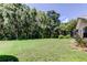 Sprawling backyard lawn offers ample space for recreation and outdoor enjoyment at 3353 Wedgewood Way, Tarpon Springs, FL 34688
