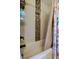 Bathtub with decorative tile niche and floral-patterned shower curtain at 3353 Wedgewood Way, Tarpon Springs, FL 34688