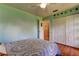 Relaxing bedroom with a view to the house interior and double closet at 3353 Wedgewood Way, Tarpon Springs, FL 34688