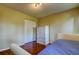 Bedroom showcasing a neutral color palette, wooden flooring, and closet at 3353 Wedgewood Way, Tarpon Springs, FL 34688