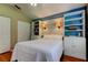 Bedroom with built-in shelving, and a closet with white doors at 3353 Wedgewood Way, Tarpon Springs, FL 34688
