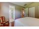 Bedroom with access to bathroom, closet, and dining room at 3353 Wedgewood Way, Tarpon Springs, FL 34688