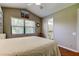 Bedroom featuring a window with wood blinds and a view into the adjoining bathroom at 3353 Wedgewood Way, Tarpon Springs, FL 34688