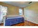 Bedroom with hardwood floors and natural light at 3353 Wedgewood Way, Tarpon Springs, FL 34688