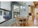 Sunlit dining area with views of the patio and access to a kitchen nook at 3353 Wedgewood Way, Tarpon Springs, FL 34688