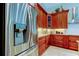Spacious kitchen with stainless steel appliances and dark wood cabinetry at 3353 Wedgewood Way, Tarpon Springs, FL 34688