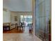 Living room with tile entryway with view of outdoor living at 3353 Wedgewood Way, Tarpon Springs, FL 34688