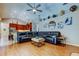 Spacious living room that connects to a modern kitchen and vaulted ceilings at 3353 Wedgewood Way, Tarpon Springs, FL 34688