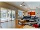 Open-concept living room with pool views, seamlessly blending indoor and outdoor living at 3353 Wedgewood Way, Tarpon Springs, FL 34688