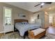 Comfortable bedroom with accent rug, shutters, and natural light at 3353 Wedgewood Way, Tarpon Springs, FL 34688