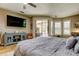 Main bedroom offers sliding glass doors out to pool and ceiling fan at 3353 Wedgewood Way, Tarpon Springs, FL 34688