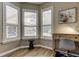 Bright office space featuring wood floors, a corner window with plantation shutters at 3353 Wedgewood Way, Tarpon Springs, FL 34688