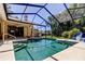 Enjoy the outdoors with this screened in pool and lush landscaping for ultimate privacy at 3353 Wedgewood Way, Tarpon Springs, FL 34688