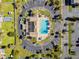 Drone image reveals the community pool area, surrounded by a parking lot and buildings at 345 S Mcmullen Booth Rd # 142, Clearwater, FL 33759