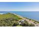 Stunning aerial shot highlighting the pristine coastline and a bustling highway alongside the ocean at 345 S Mcmullen Booth Rd # 142, Clearwater, FL 33759