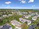 An aerial view of condos surrounded by lush greenery, with water views in the distance at 345 S Mcmullen Booth Rd # 142, Clearwater, FL 33759