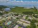 Scenic overhead image featuring condominiums, lush landscape, and a sprawling waterfront backdrop at 345 S Mcmullen Booth Rd # 142, Clearwater, FL 33759