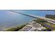 Aerial view capturing a bridge over the water near industrial buildings surrounded by lush greenery at 345 S Mcmullen Booth Rd # 142, Clearwater, FL 33759