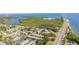 Scenic aerial view of the neighborhood by the bay, displaying lush greenery and a vibrant community at 345 S Mcmullen Booth Rd # 142, Clearwater, FL 33759
