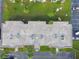 Aerial view of condo's roof with multiple AC units and lush green landscaping surrounding the building at 345 S Mcmullen Booth Rd # 142, Clearwater, FL 33759