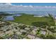 Overhead view showing neighborhood, condominiums, and lush greenery with waterfront panorama at 345 S Mcmullen Booth Rd # 142, Clearwater, FL 33759