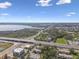 Extensive aerial view of the property showcasing the surrounding area, including a lake and highway at 345 S Mcmullen Booth Rd # 142, Clearwater, FL 33759