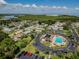 Aerial view of the neighborhood, featuring the community pool and surrounding residences near the beautiful bay at 345 S Mcmullen Booth Rd # 142, Clearwater, FL 33759